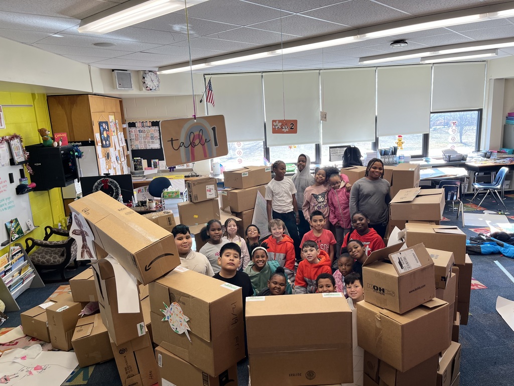 Third grade with their life size gingerbread house