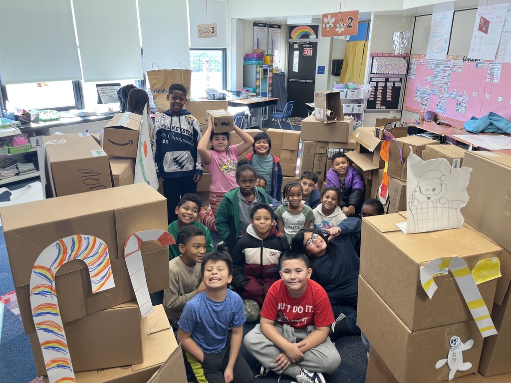 Third grade with their life size gingerbread house