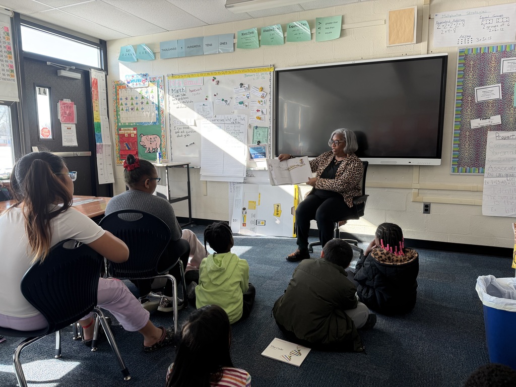 School Board Vice President, Cynthia Davenport, reads to Cole Manor students. 