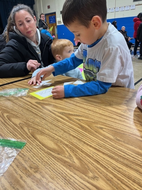 A student and his family at math night