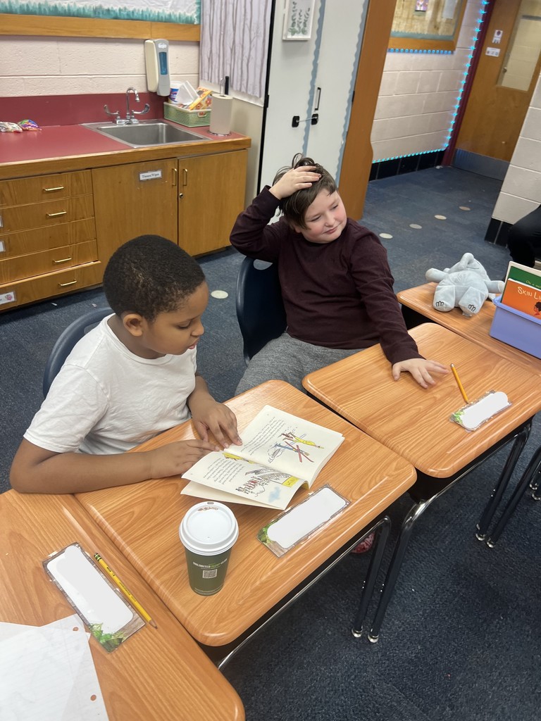 Best Buddies reading together.