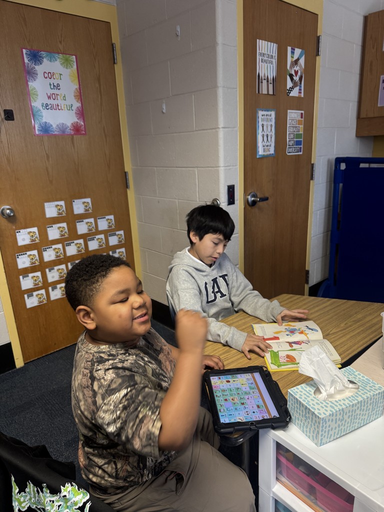Best Buddies reading together.