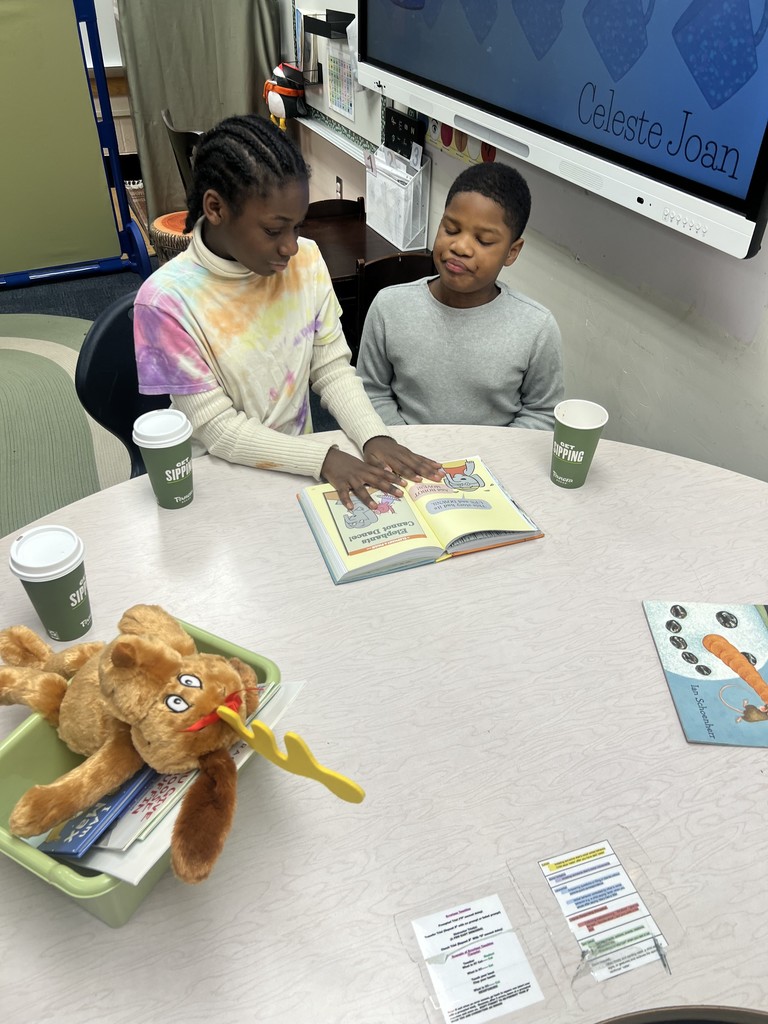 Best Buddies reading together.
