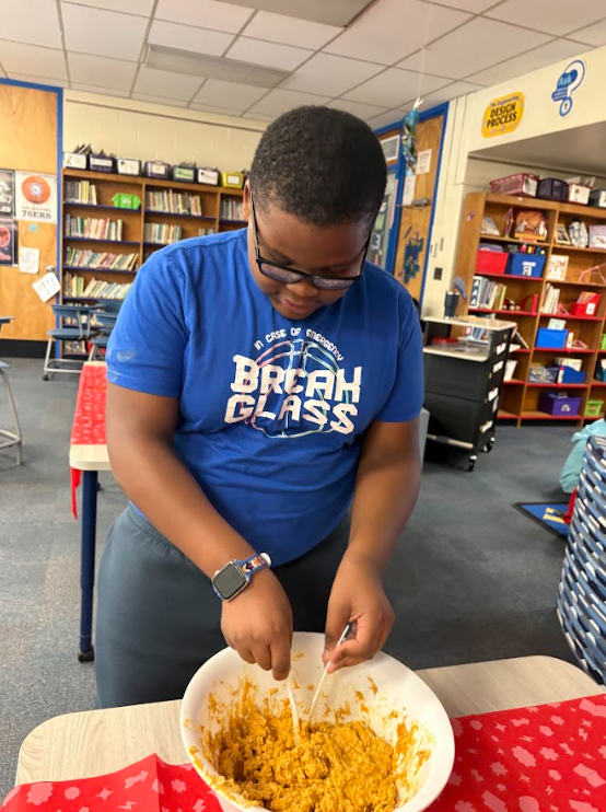 A student making dog treats