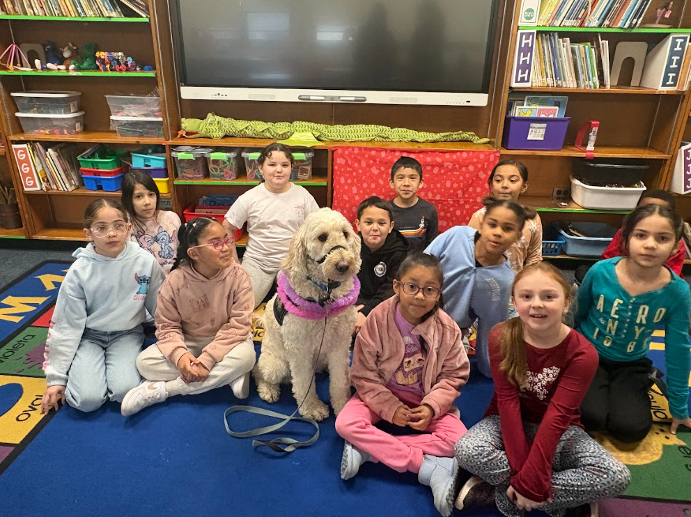 Students taking a picture with Nutmeg