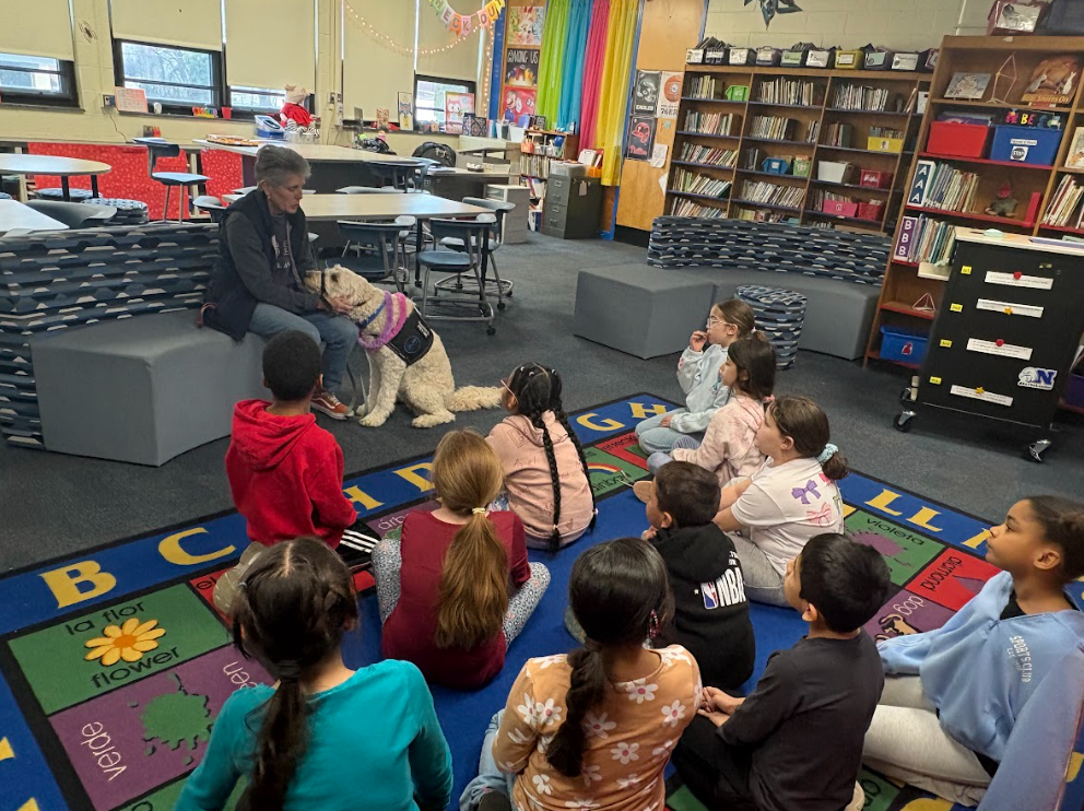 Students talking to Nutmeg's owner