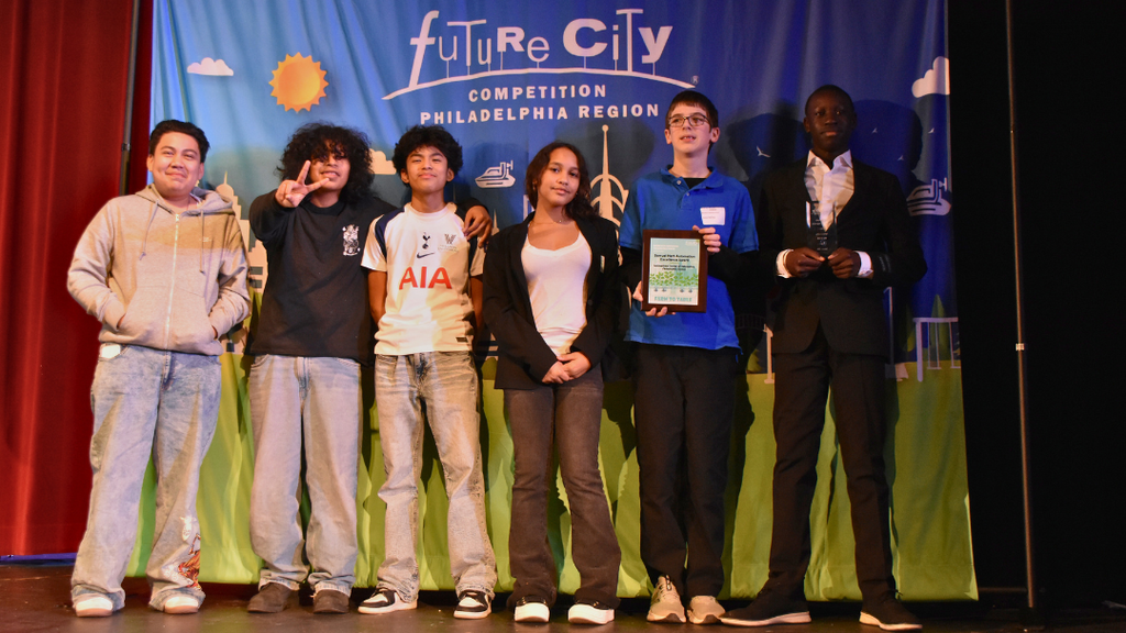 Six students on stage at the Future Cities Competition.