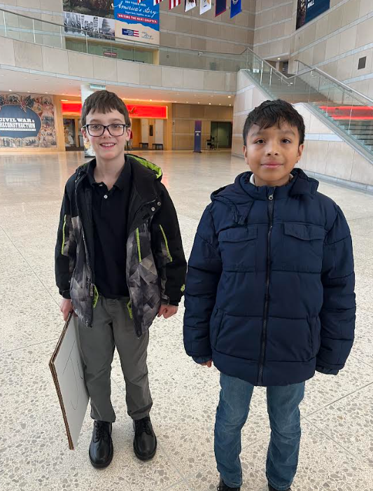 5th graders David Reiley and Giovanni Estarda pose for a photo.