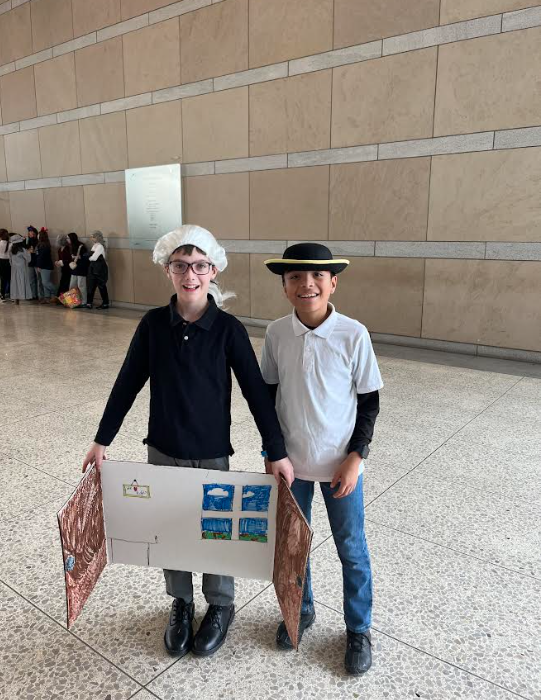 5th graders David Reiley and Giovanni Estarda pose for a photo.