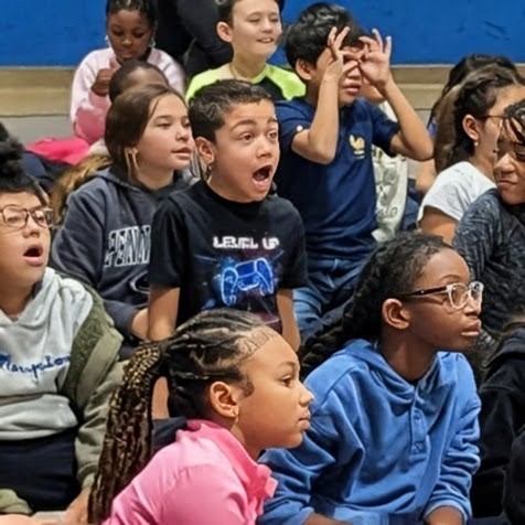 Students watching the magician