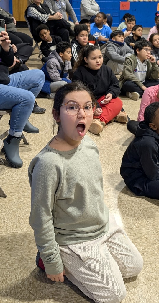 A student watching the magician
