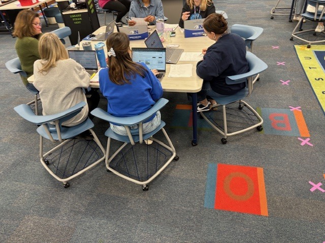 Staff discussing data. 