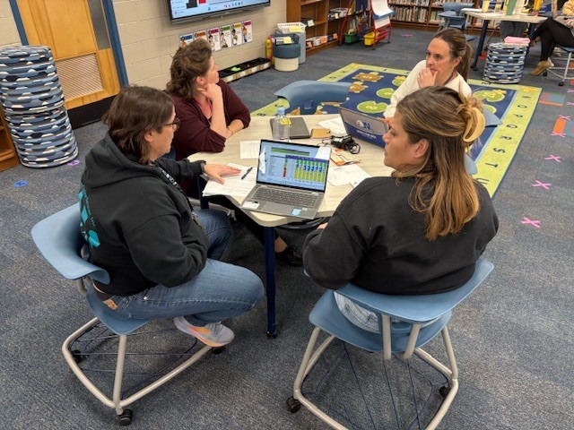 Staff discussing data. 