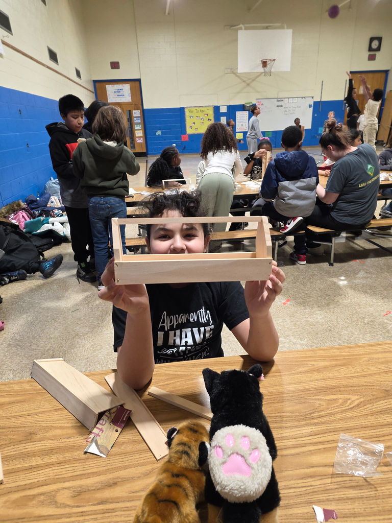 A student showing her project at Scouts