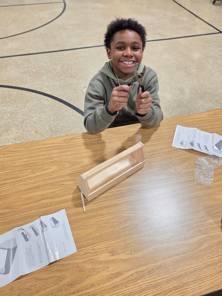 A student using a tool at Scouts