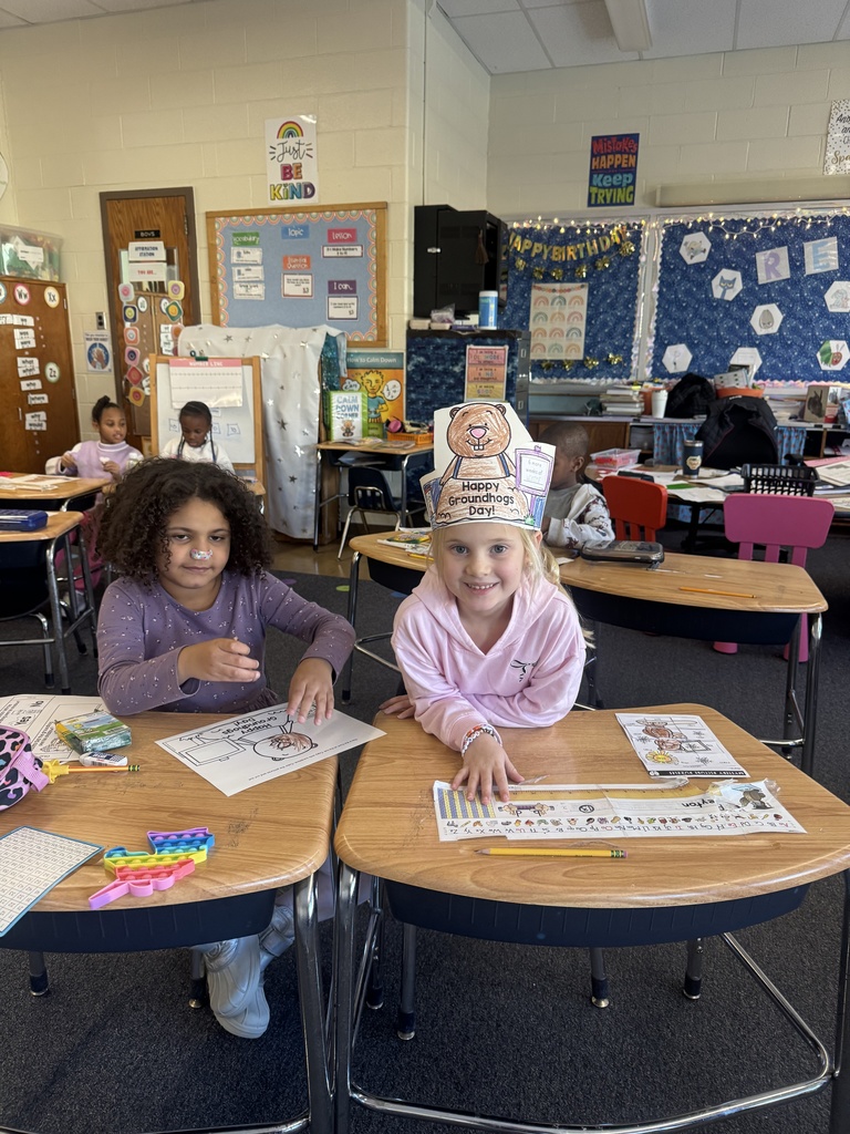 First graders create Groundhog Day hats.