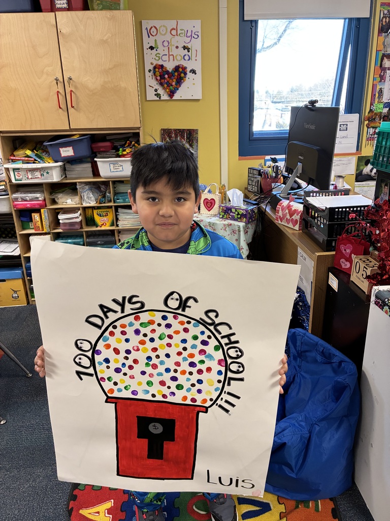 student showing 100th day of school project