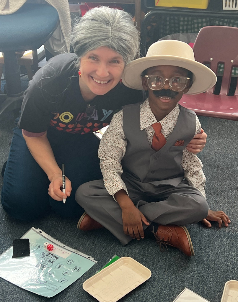 Mrs. Browne and a student dressed as centenarians.