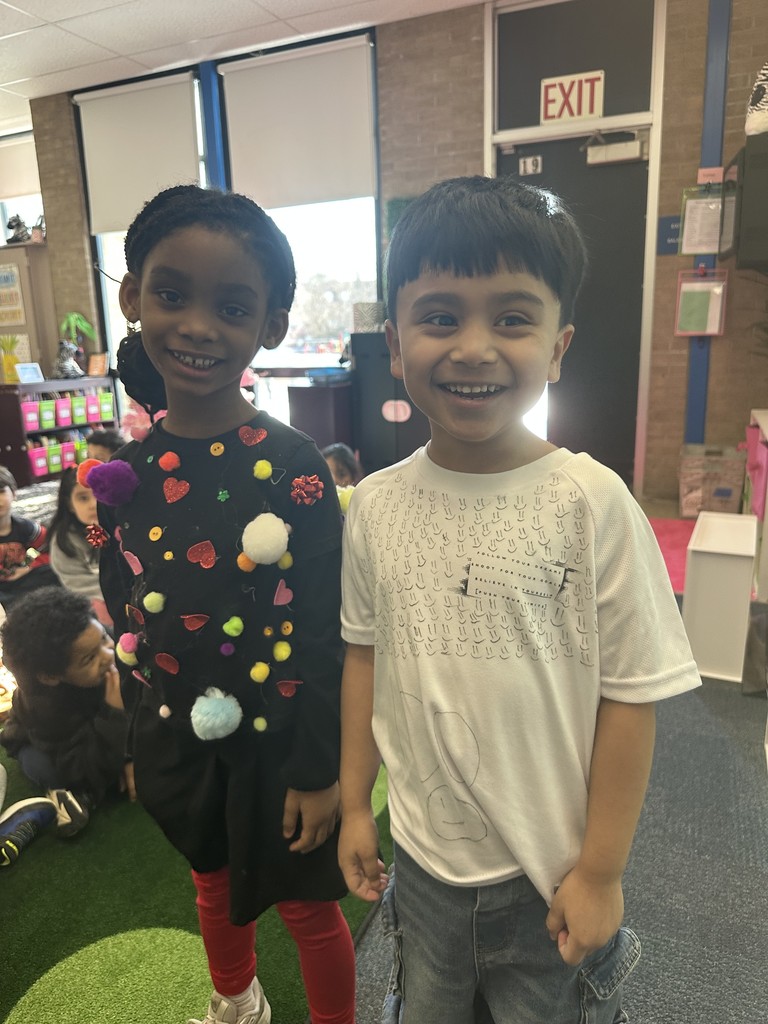 Student dressed in a 100th Day of School shirt.