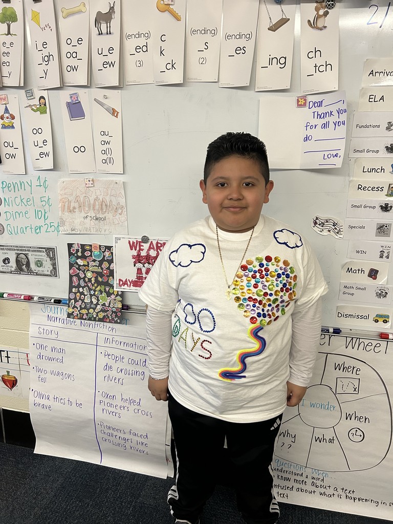 A student dressed in a 100th Day of School shirt.