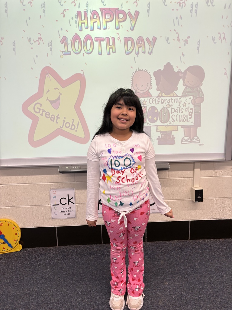 A student dressed in a 100th Day of School shirt.