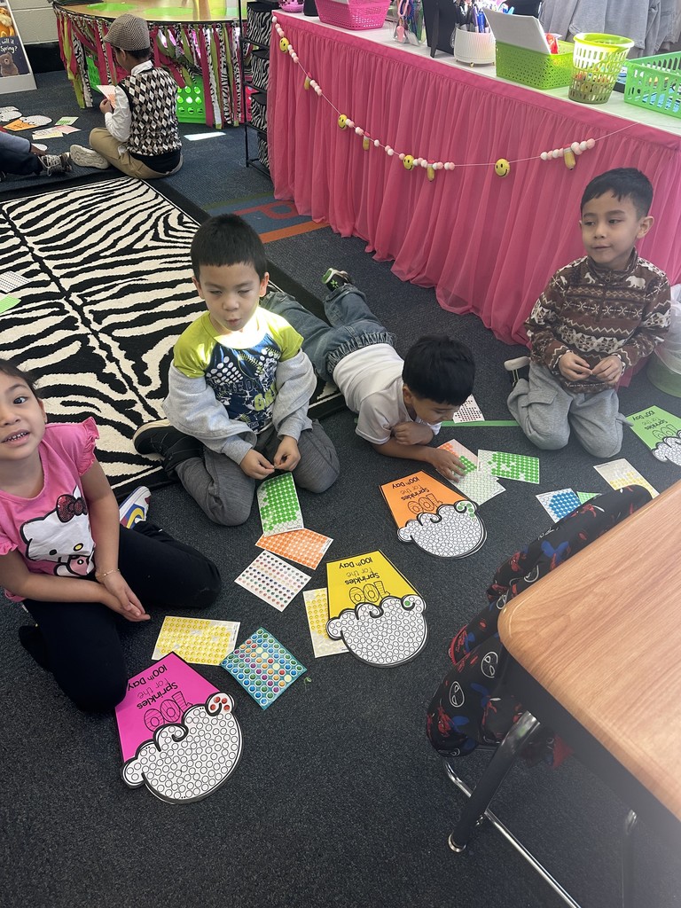 Kindergarteners make a fun cupcake project with 100 sprinkles.