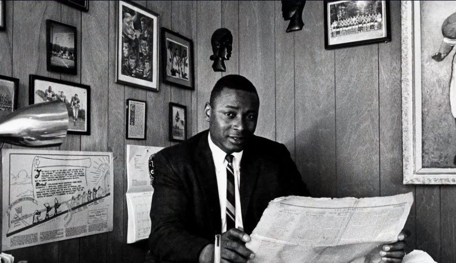 Charles Blockson reads a newspaper in his office.