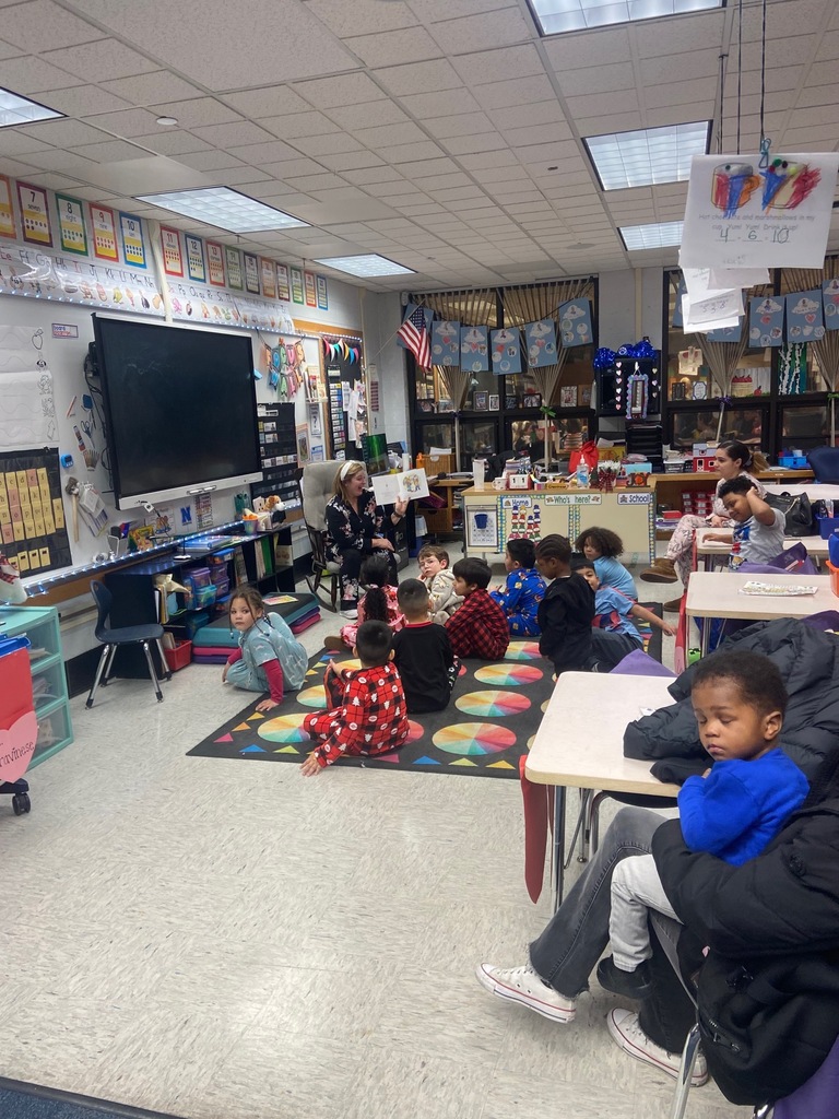 Students listening to a book reading.