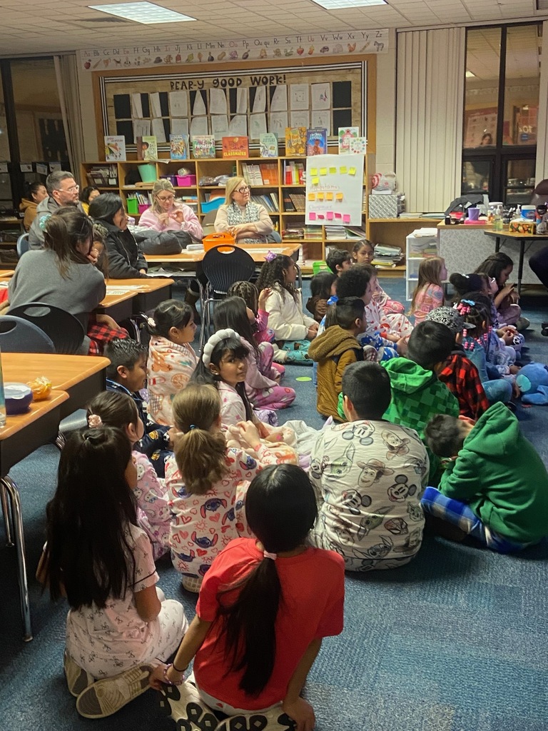 Students listening to a book reading.