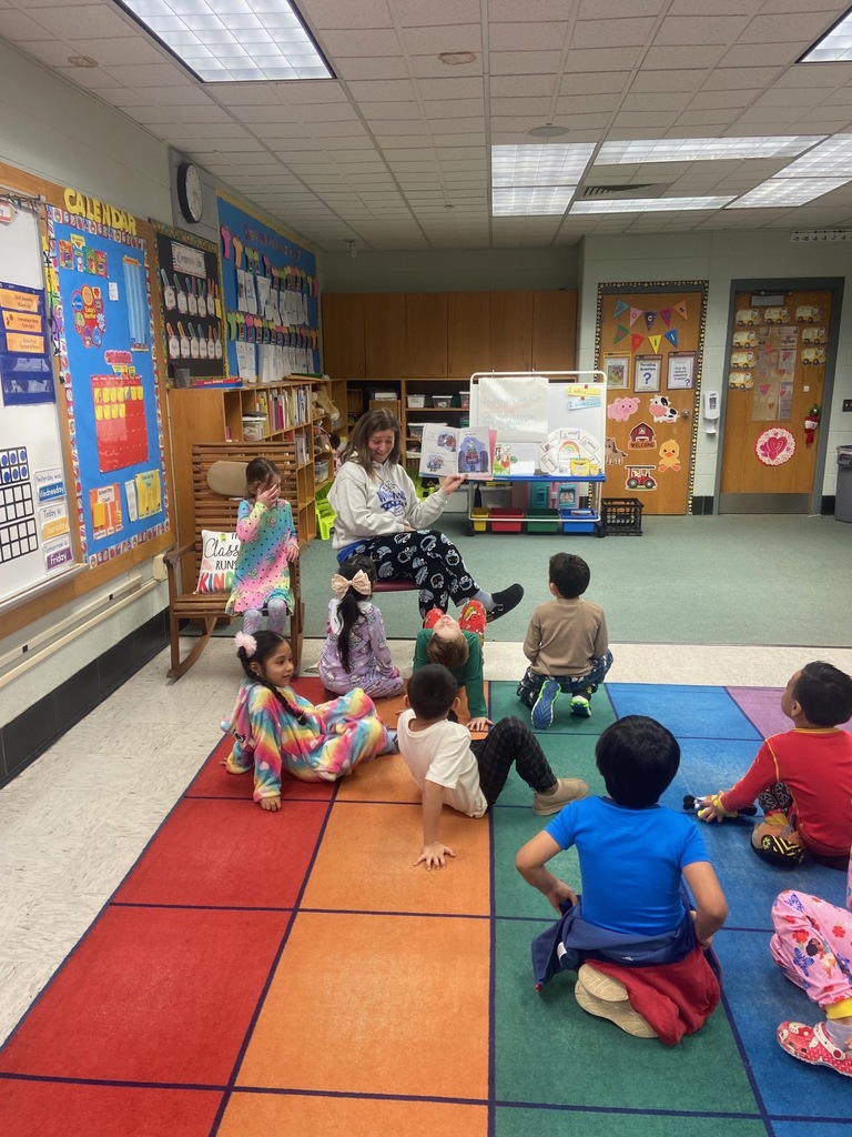 Students listening to a book reading.