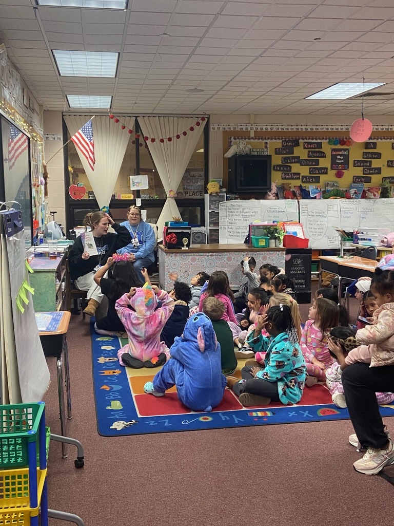 Students listening to a book reading.