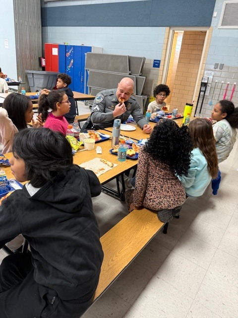 West Norriton Township police officers visit fourth graders and bring pizza for lunch.