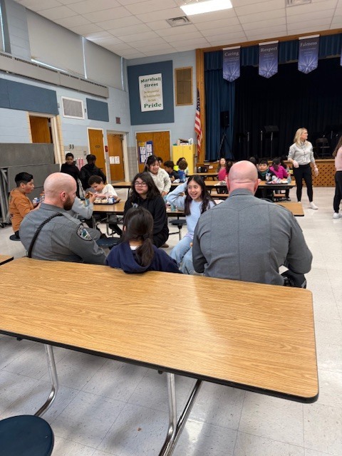 West Norriton Township police officers visit fourth graders and bring pizza for lunch.