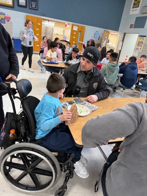 West Norriton Township police officers visit fourth graders and bring pizza for lunch.