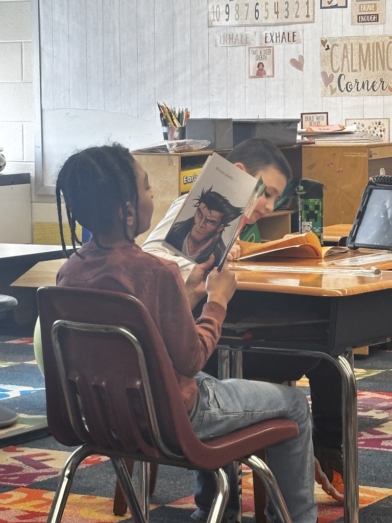 Students reading their new books for Read Across America Week