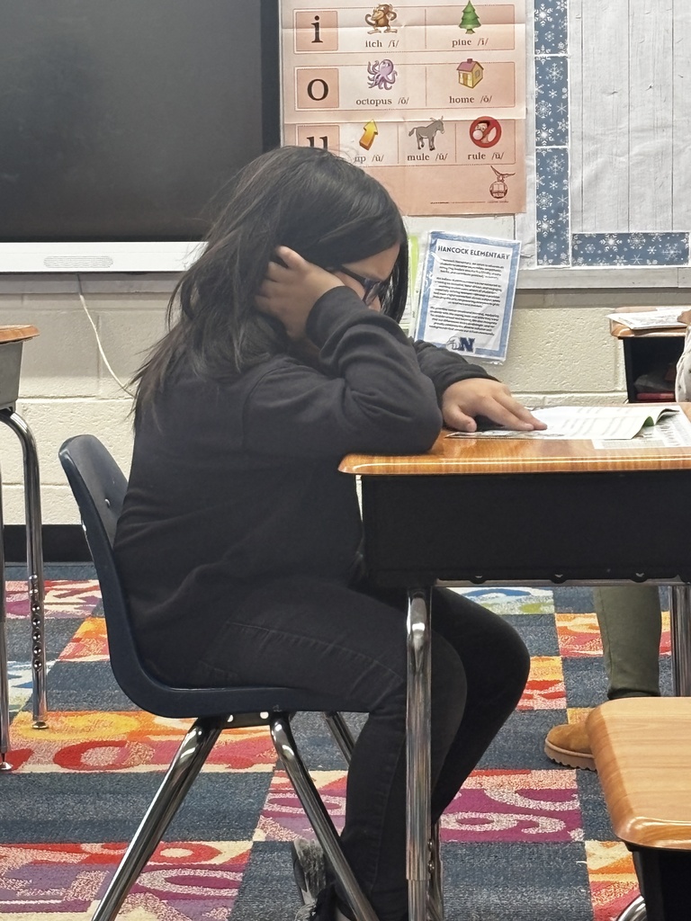 A student reading their new book for Read Across America Week