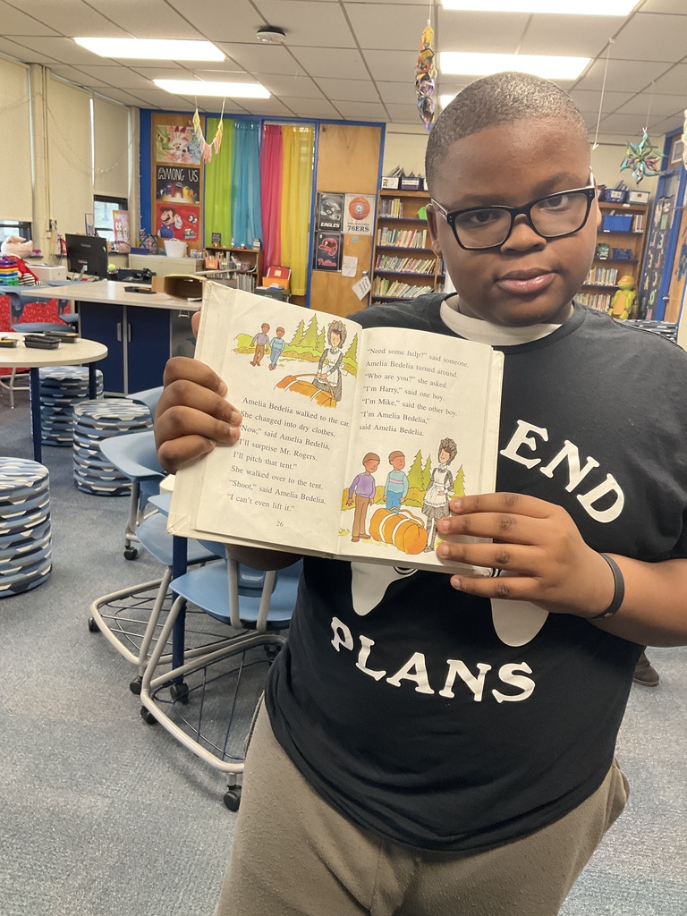A student showing his book during DEAR time
