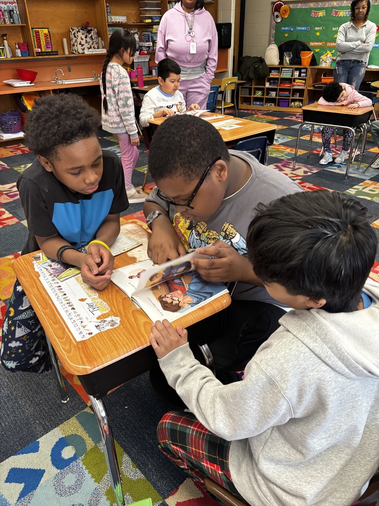 Students buddy reading together