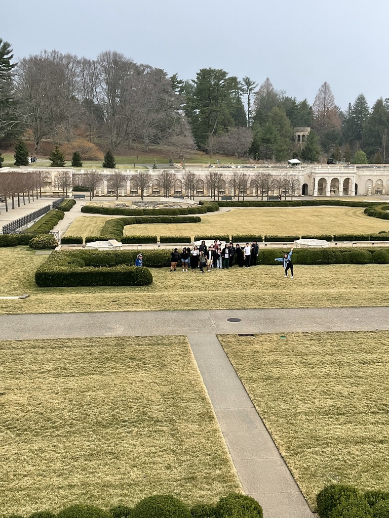 Students are gathered in a field