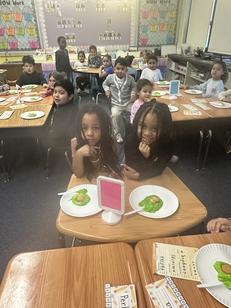 Students enjoy a green snack for Green Eggs & Ham Day.