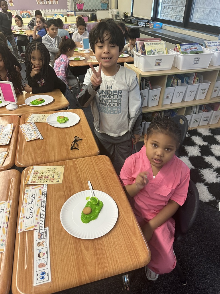 Students enjoy a green snack for Green Eggs & Ham Day.