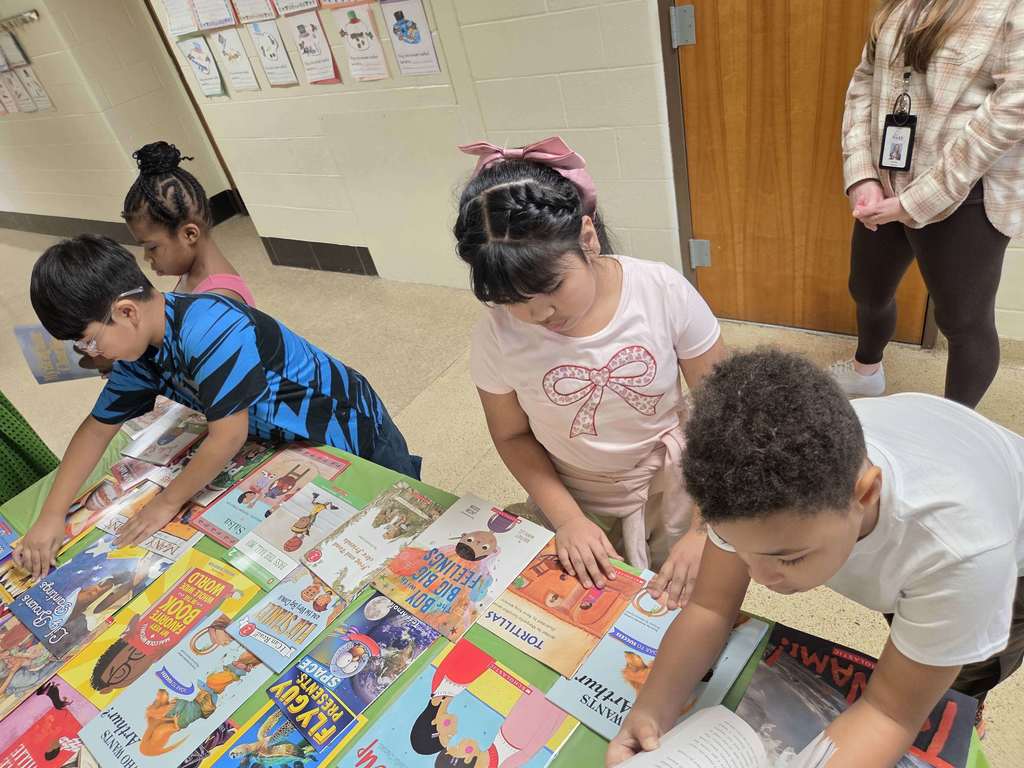 Students select a new book through the RIF program.
