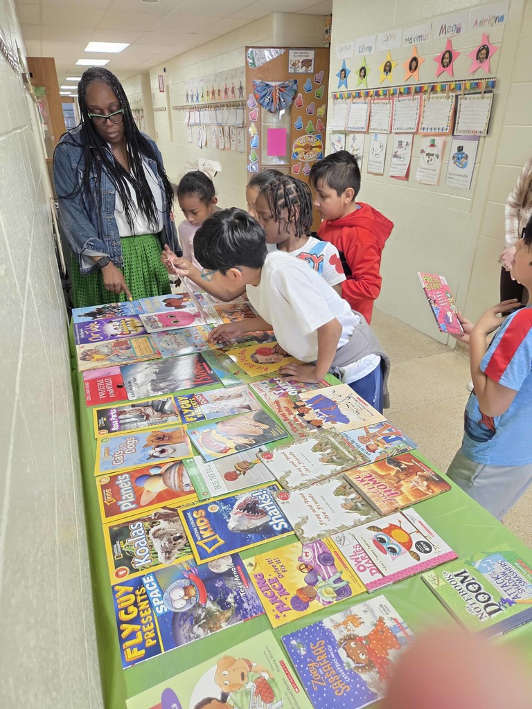 Students select a new book through the RIF program.
