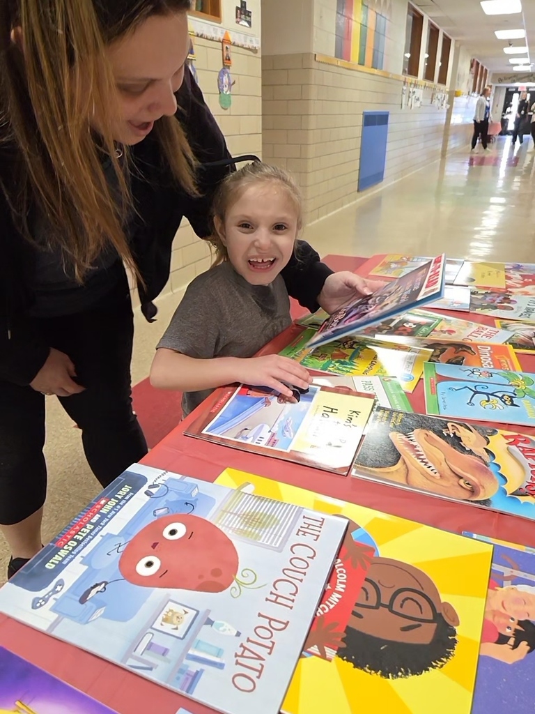A student selects a new book through the RIF program.