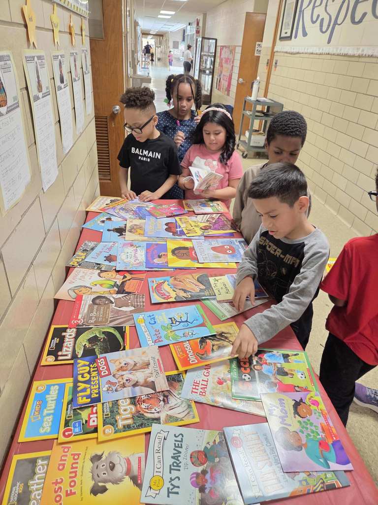 Students select a new book through the RIF program.