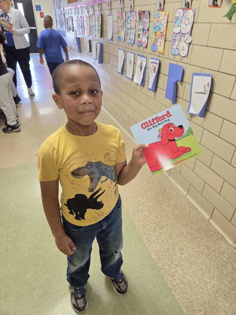 A student shows his new RIF book.