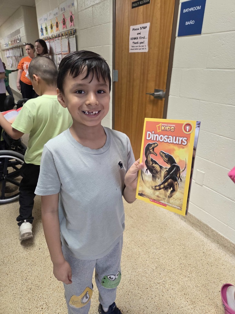 A student shows his new RIF book.