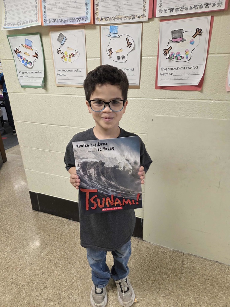 A student shows his new RIF book.