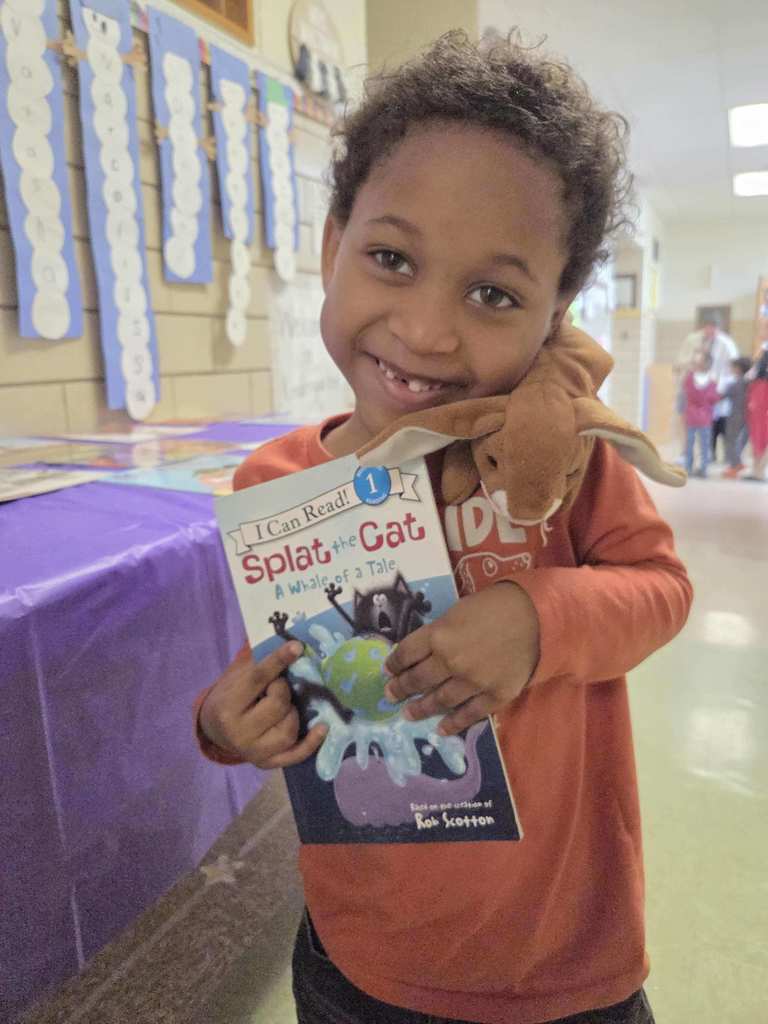 A student shows his new RIF book.
