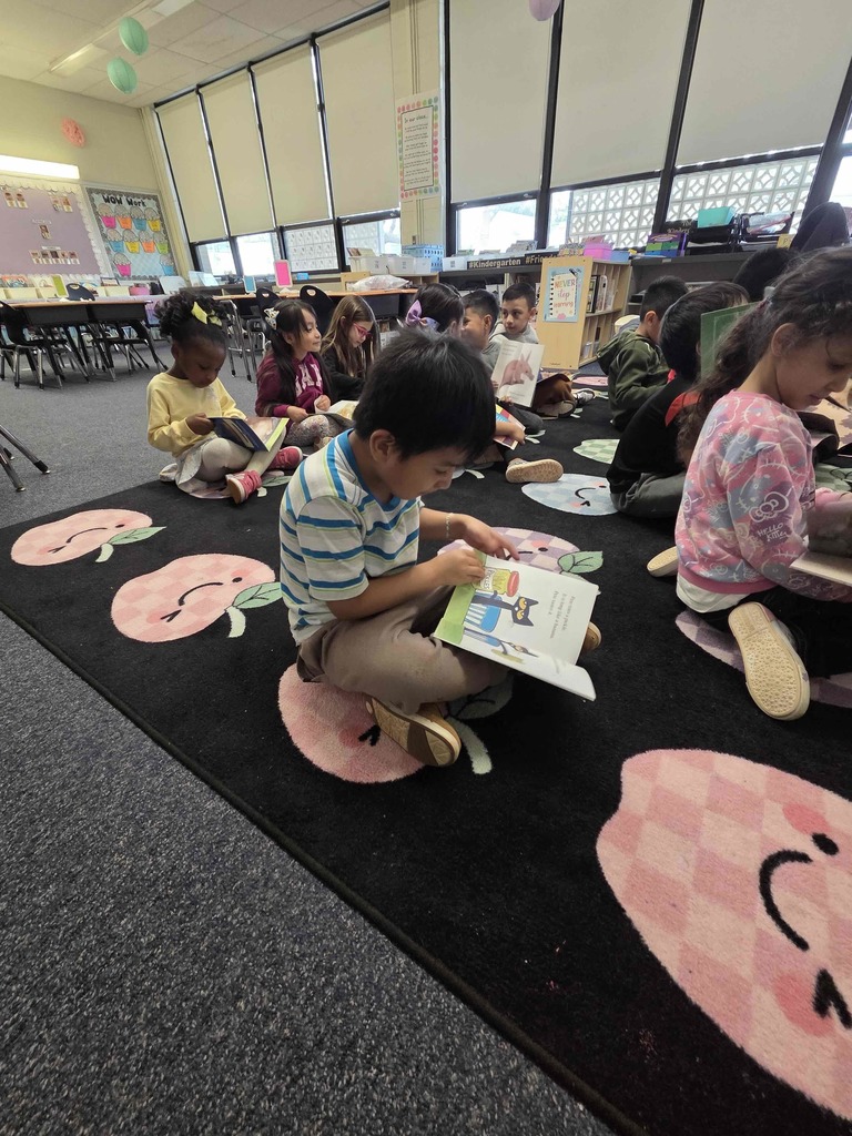 Students read their new RIF books.